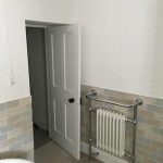 Bathroom showing a combined towel rail and radiator
