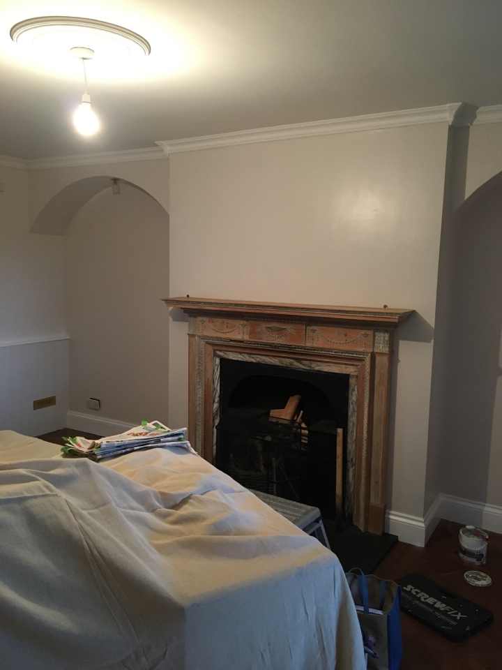 Lounge with Victorian wooden fireplace.